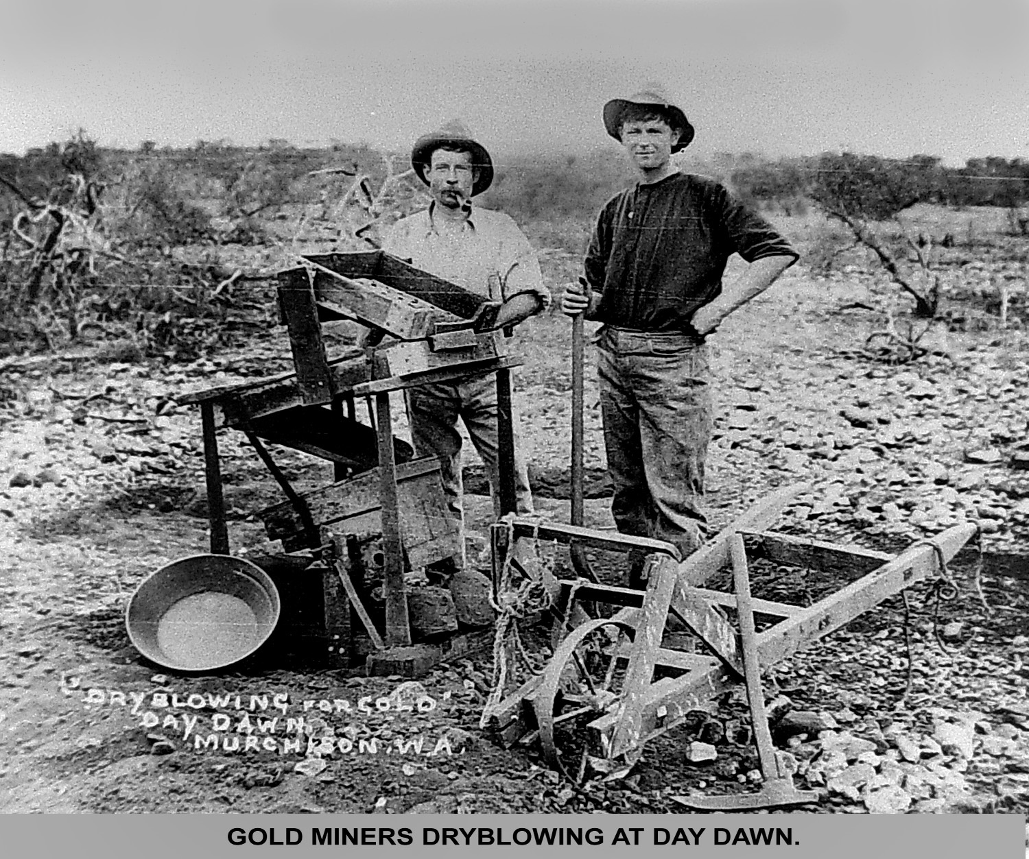 Gold miners dryblowing at Day Dawn