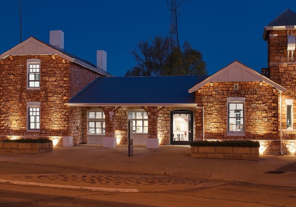 Cue Government Buildings and former Post Office illuminated at night