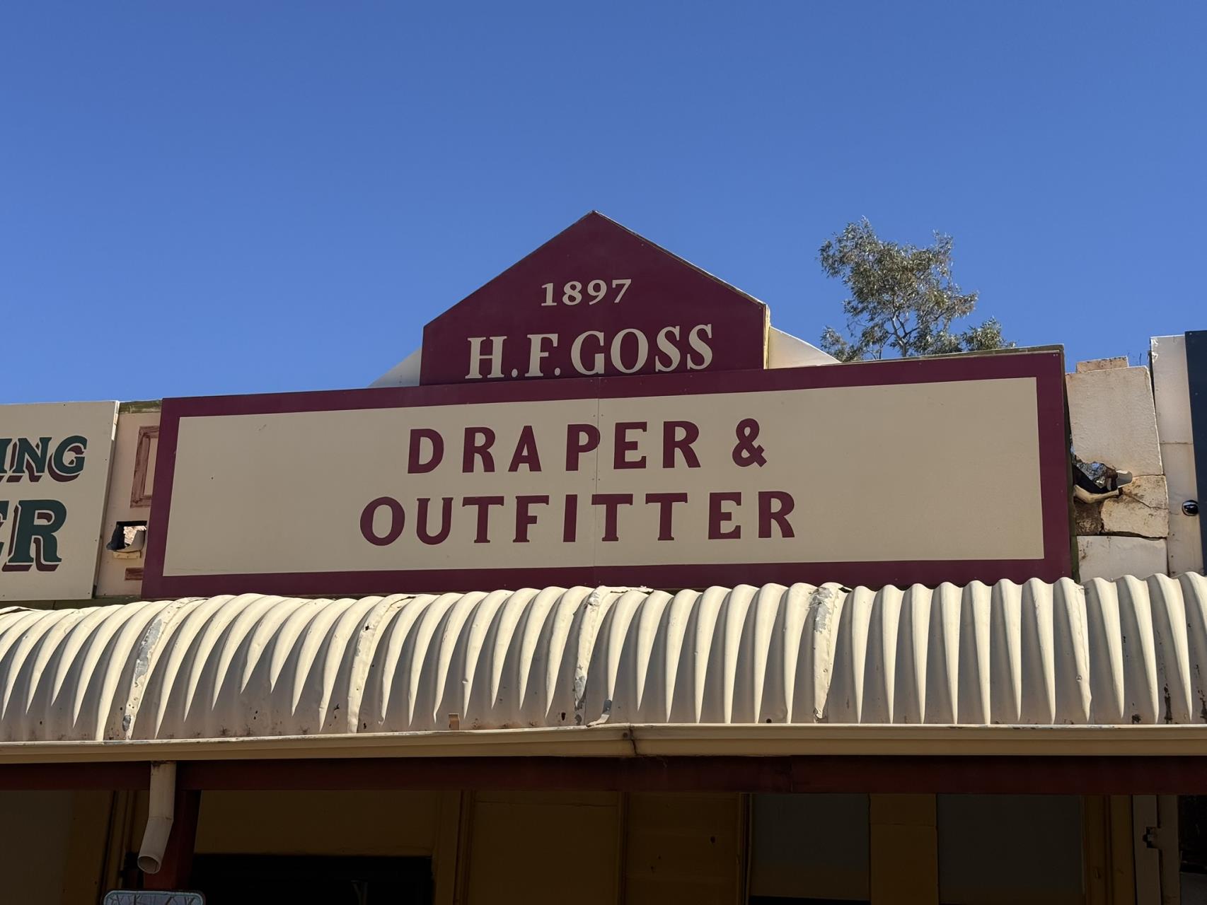 H. F. Goss Draper and Outfitter heritage sign in Austin Street Cue