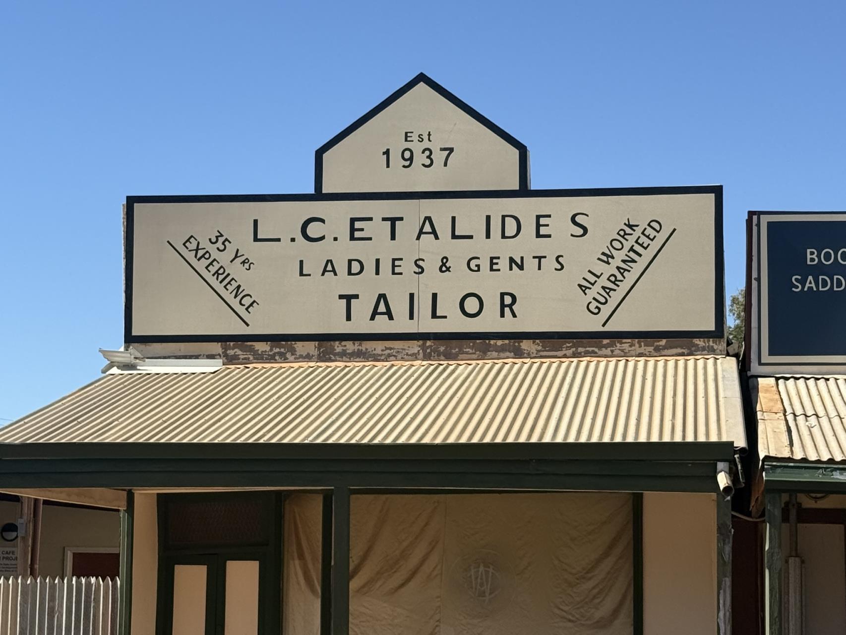 L C Etalides Ladies and Gents Tailor heritage sign in Austin Street Cue