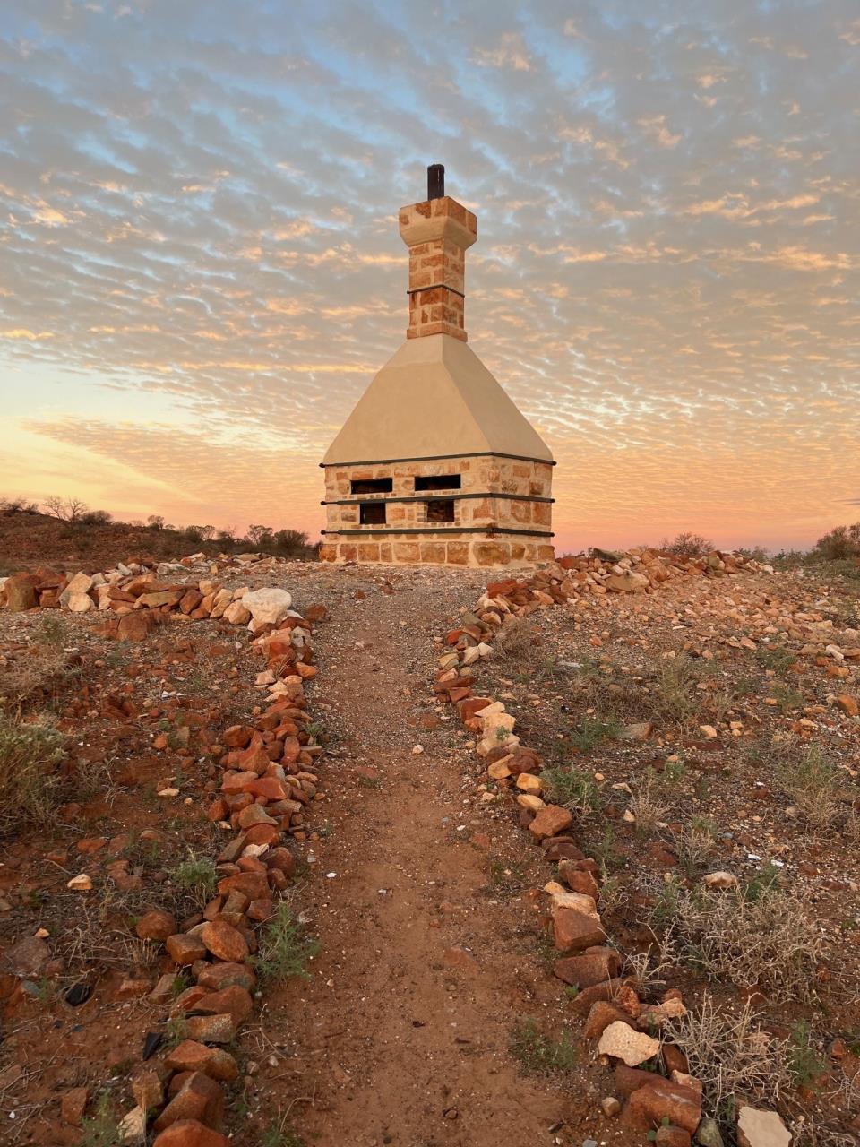 Surviving stone chimney at the Old Cue Hospital site