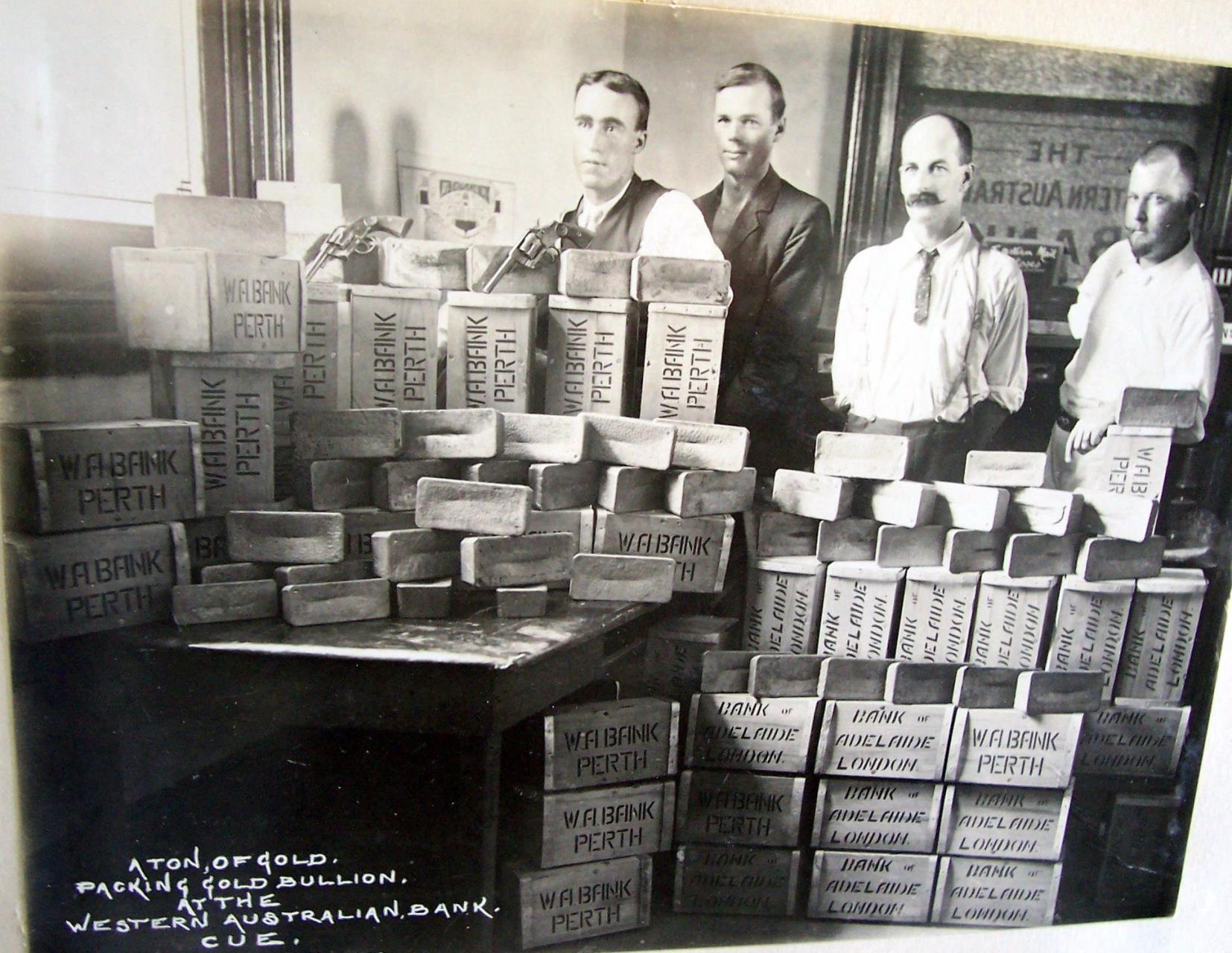 Historic photograph captioned as one ton of gold bullion being packed at the Western Australian Bank in Cue