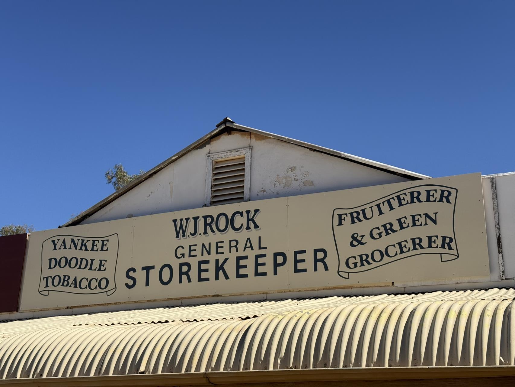 W J Rock General Storekeeper heritage sign in Austin Street Cue